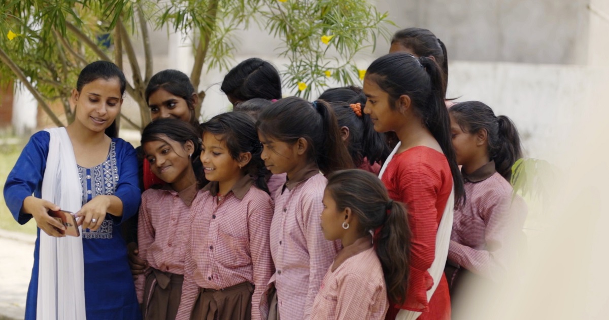 Women and girls using digital technology